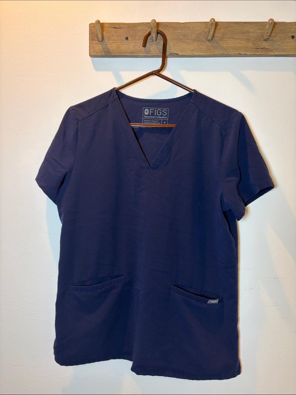 Figs navy blue front pocket scrub top size M